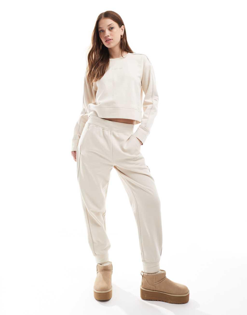 Calvin Klein Tonal Logo lounge crew neck sweatshirt in cream Product Image