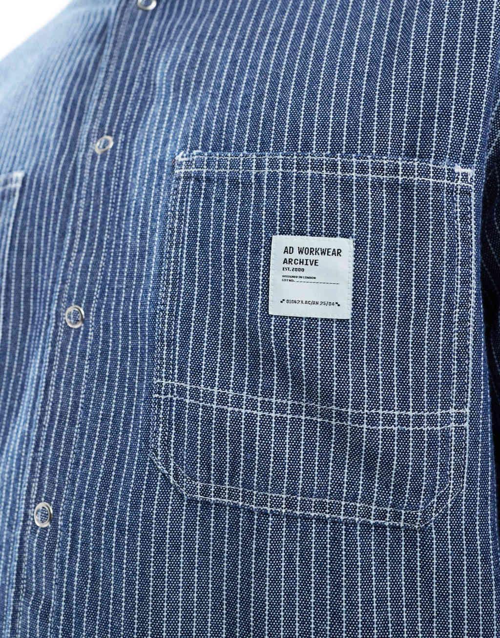 ASOS DESIGN boxy relaxed denim shirt with badge in navy stripe Product Image