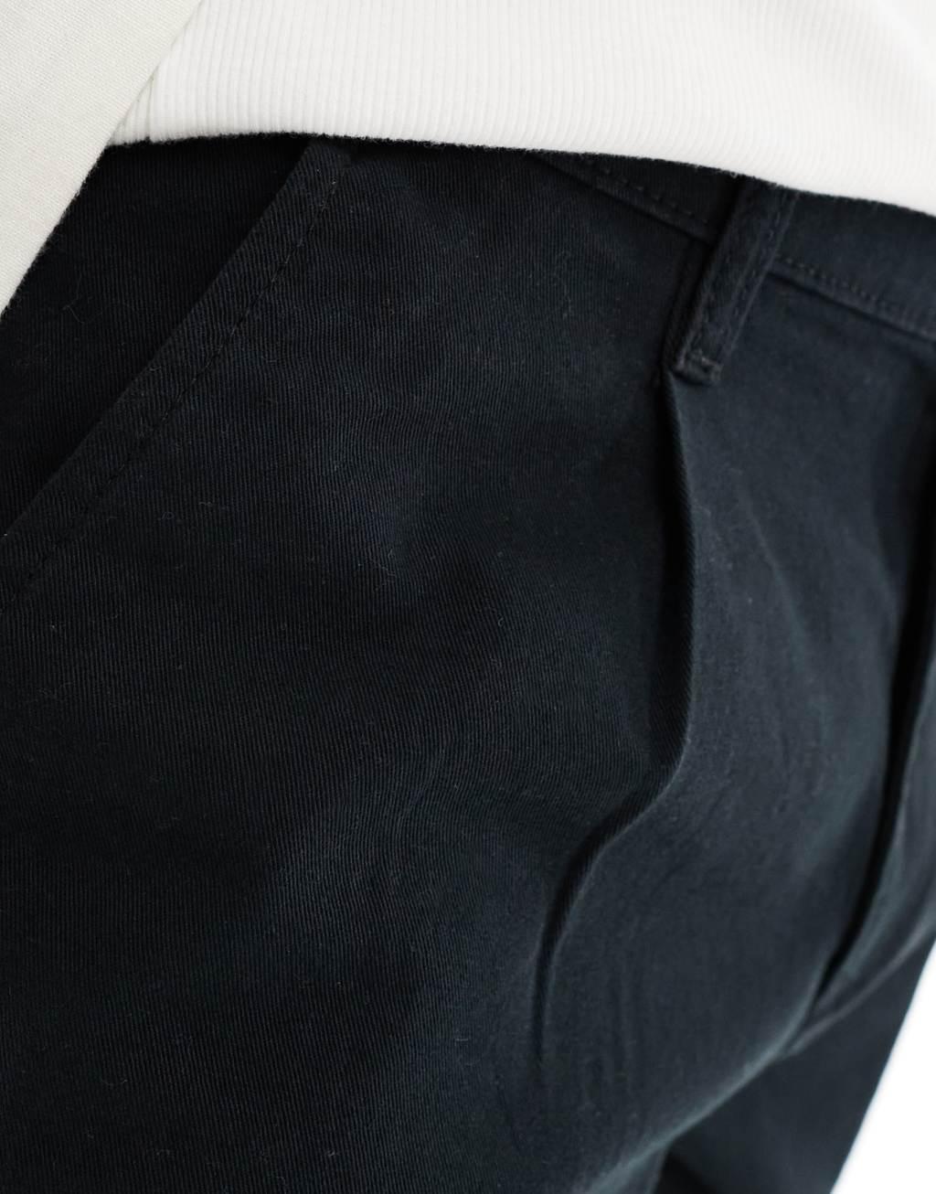 ASOS DESIGN pleated chino shorts in black Product Image