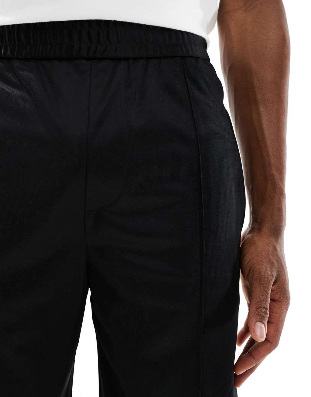 Bershka wide fit side panel sweatpants in black Product Image