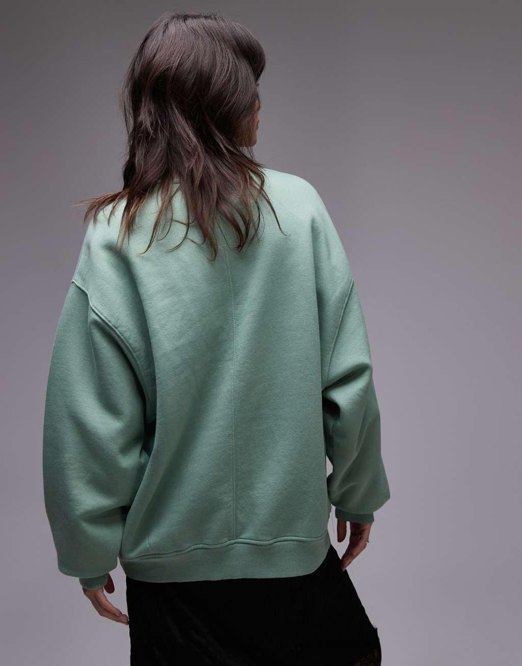 Topshop oversized washed sweatshirt with abstract graphic in green Product Image