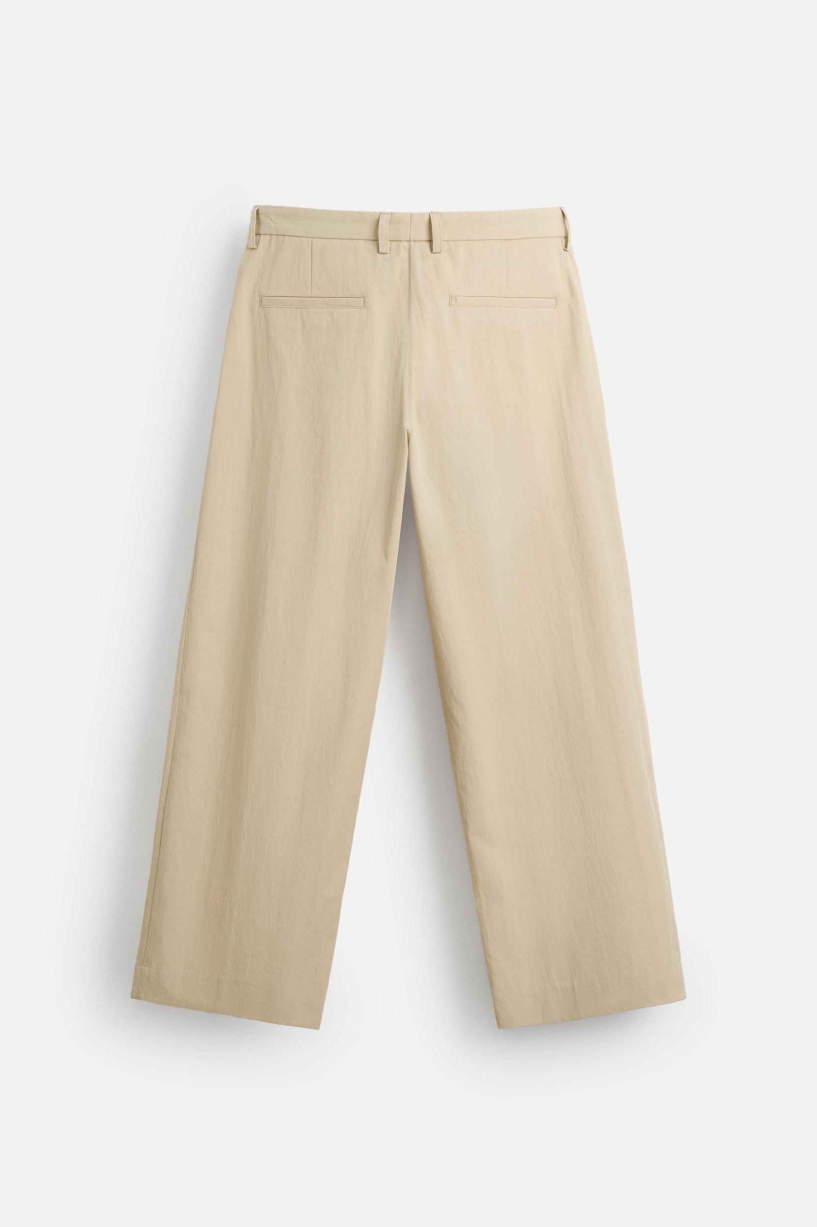 LIMITED EDITION RELAXED FIT PLEATED PANTS Product Image