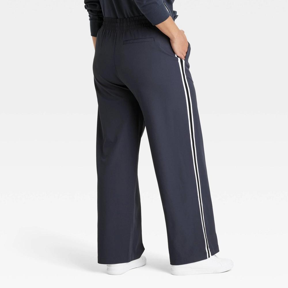 Womens Woven High-Rise Track Pants - All In Motion Dark Blue S: Recycled Polyester, Spandex, Moisture Wicking, Quick Drying Product Image