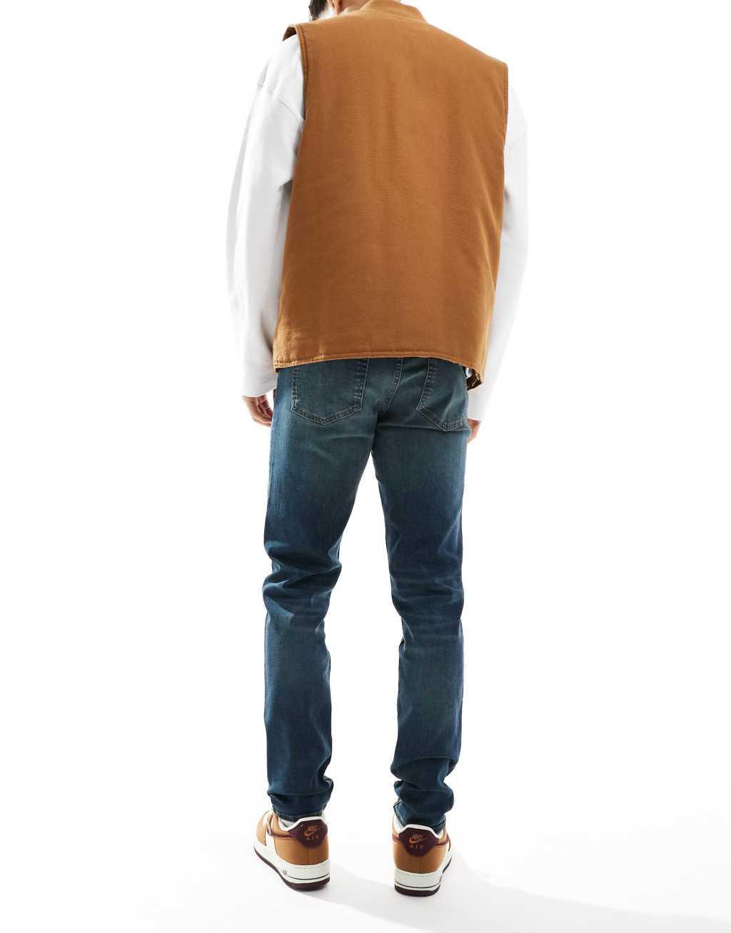 ASOS DESIGN skinny jeans with green tint in mid wash blue Product Image