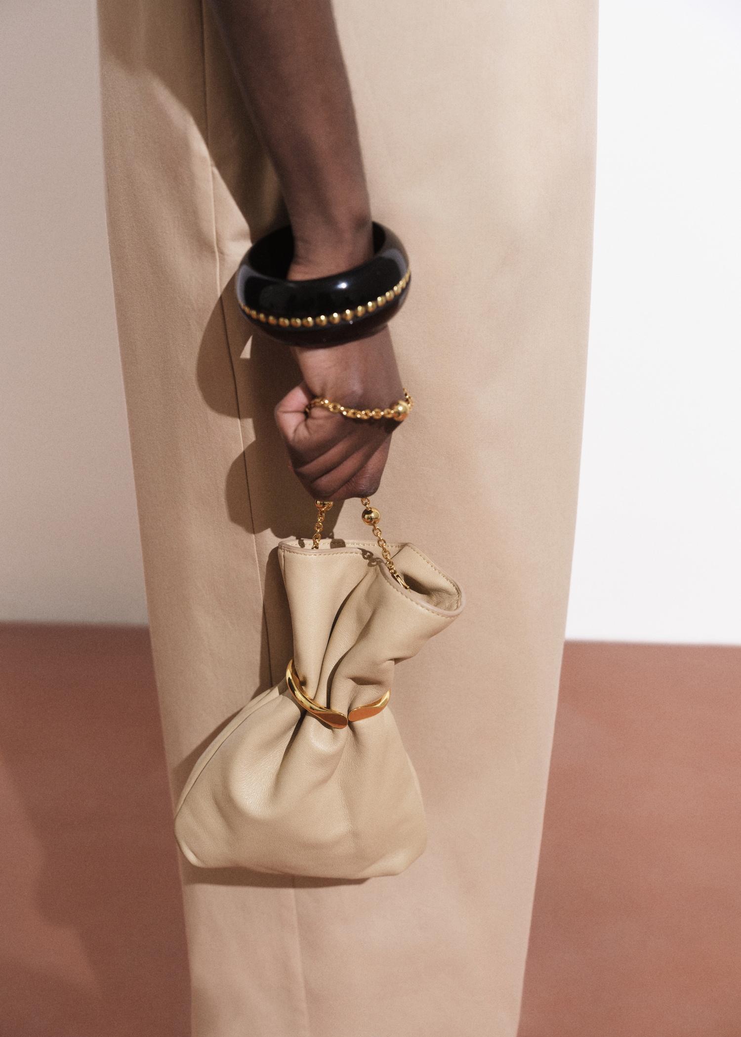 Leather sack-style bag with metallic detail - Women | MANGO USA Product Image