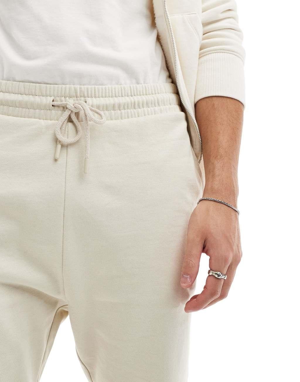ASOS DESIGN skinny fit shorts in stone Product Image