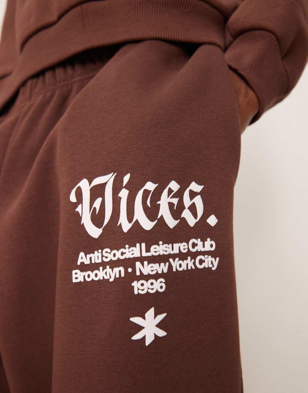 ASOS DESIGN baggy balloon sweatpants with print in brown Product Image
