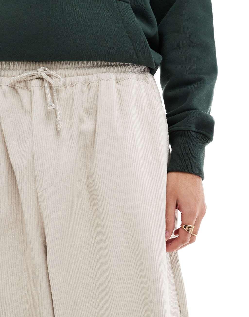 ASOS DESIGN baggy parachute cord pants in cream Product Image