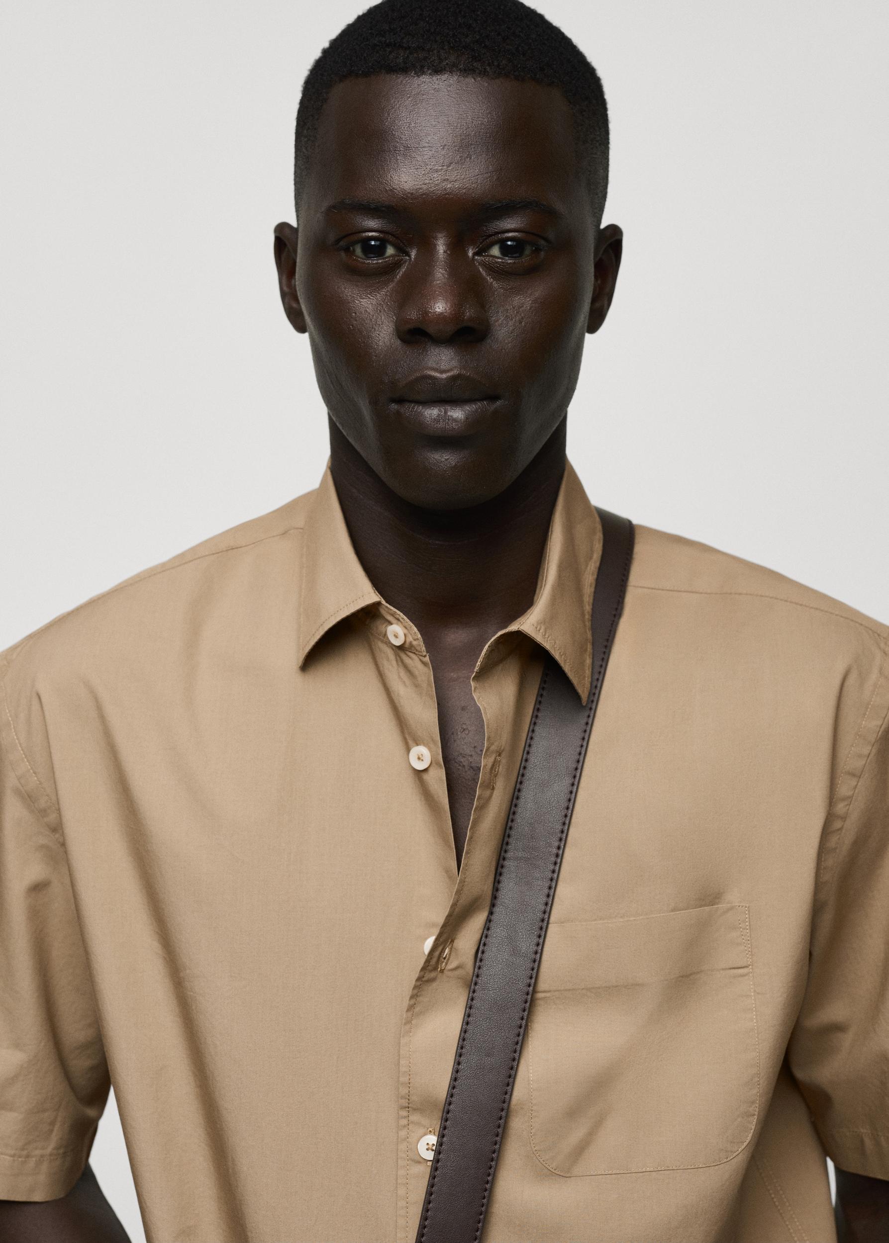 Tencel™™ cotton shirt with pocket - Men | MANGO USA Product Image
