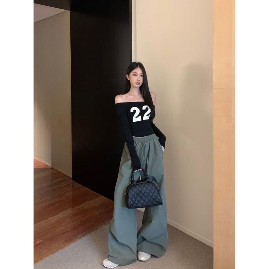 Off Shoulder Long-Sleeve Numbering Printed Cropped Tee / Mid Rise Plain Wide Leg Pants Product Image