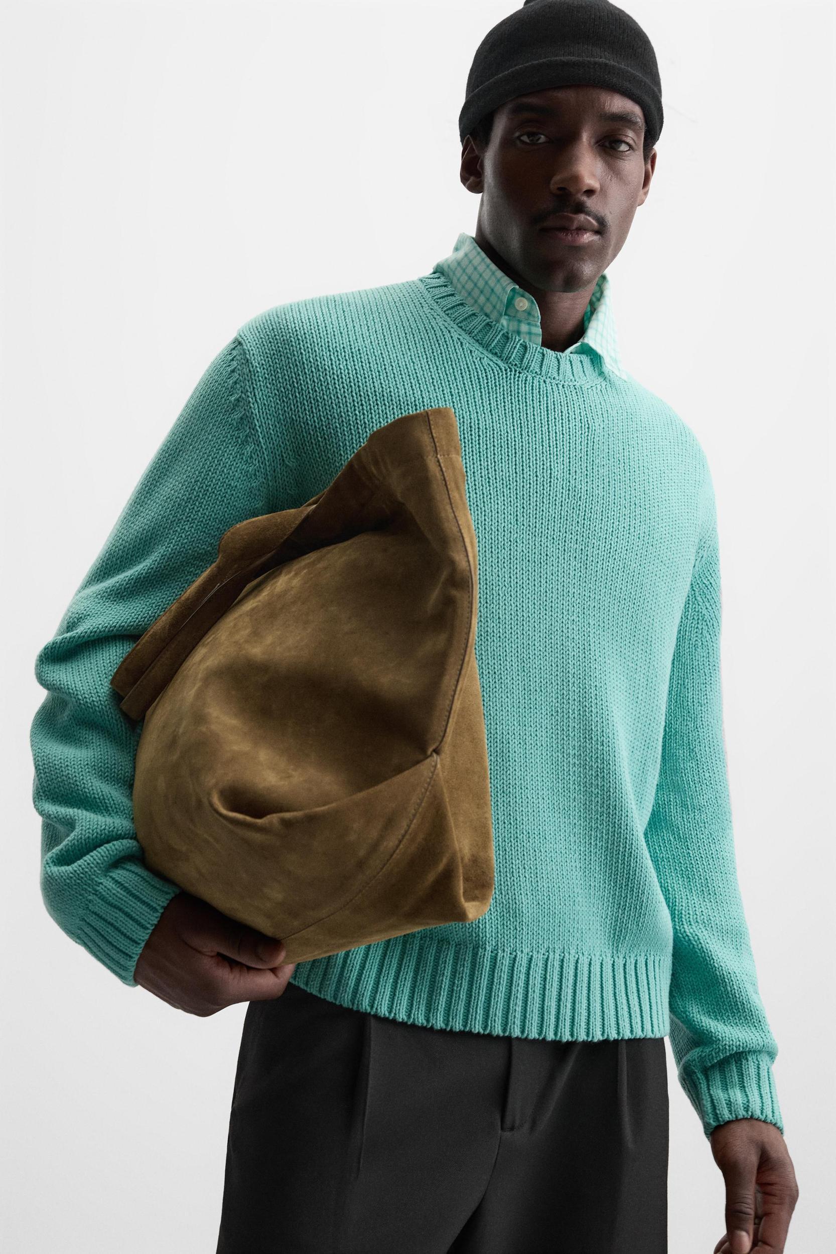 Relaxed fit cotton blend sweater. Round neck and long sleeves. Rib trim. Product Image