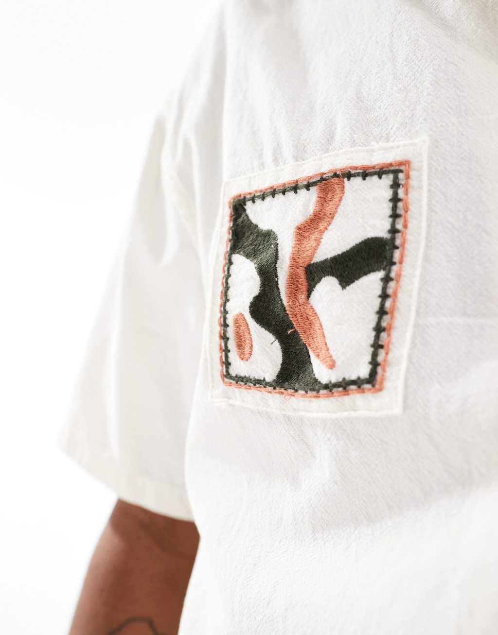 Bershka floral embroidered stitch shirt in beige Product Image