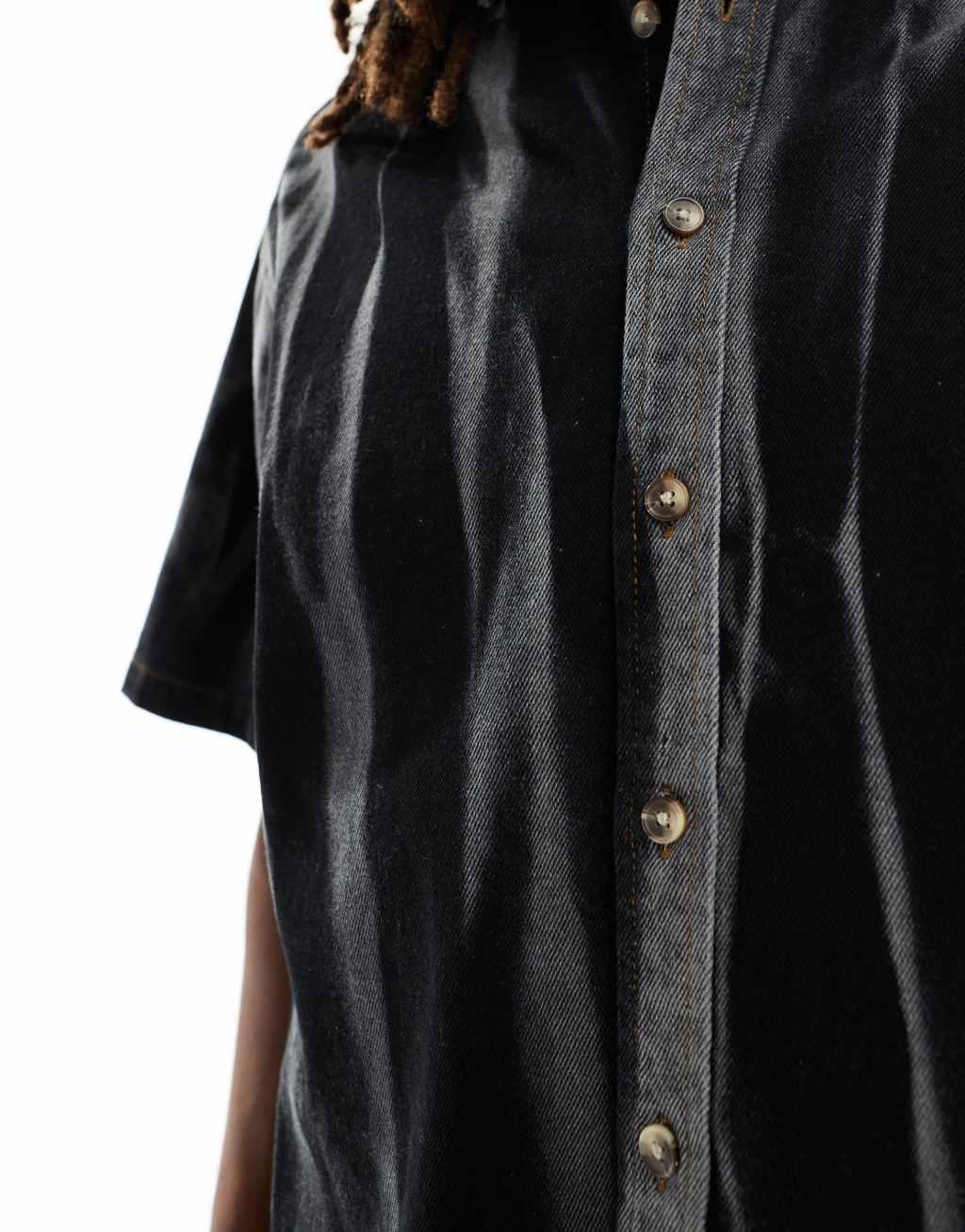 ASOS DESIGN boxy oversized short sleeve denim shirt with acid wash stripes in black Product Image