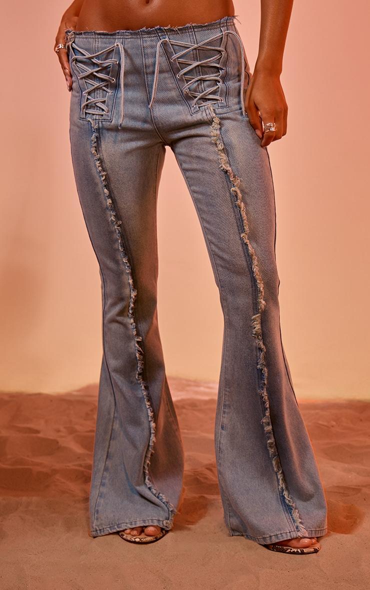 Light Blue Vintage Wash Front Frayed Seam Lace Up Detail Flared Jeans Product Image