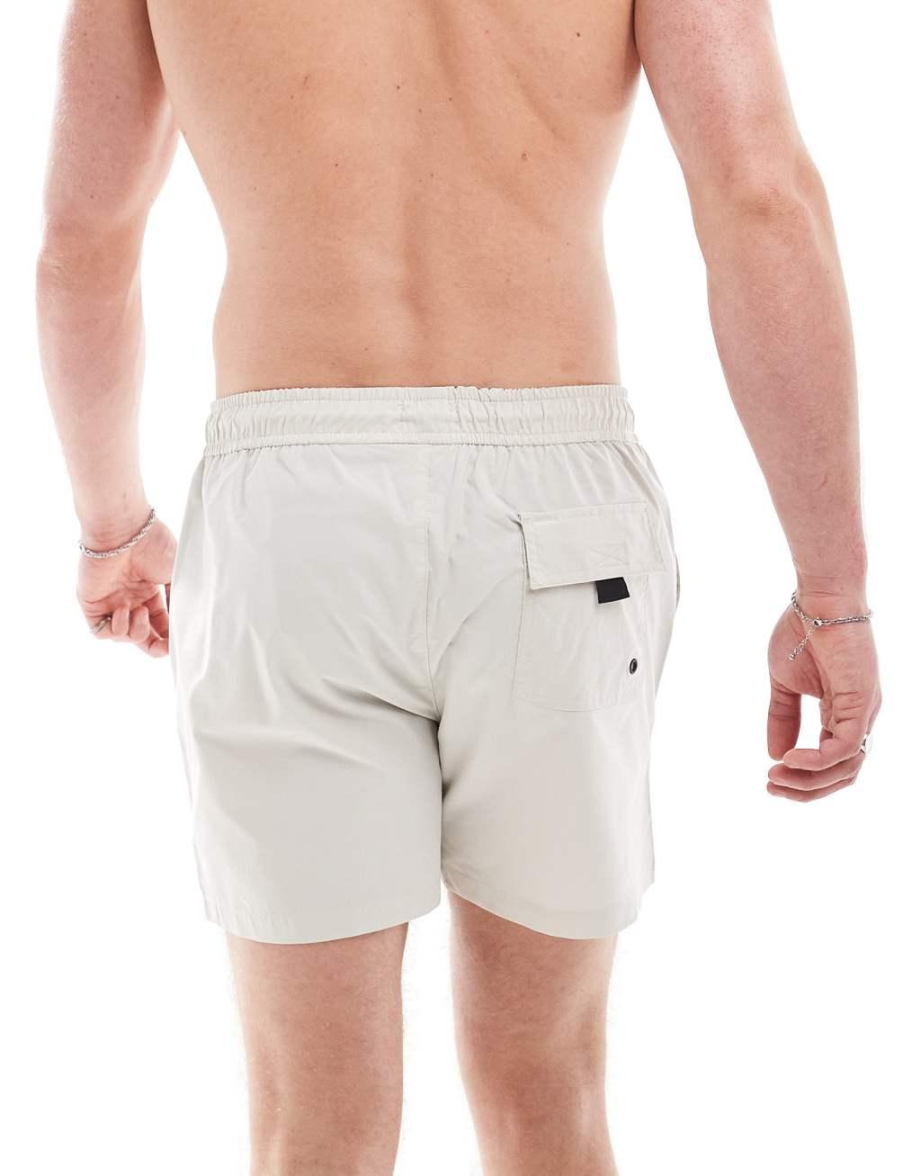 River Island swim shorts in light stone Product Image