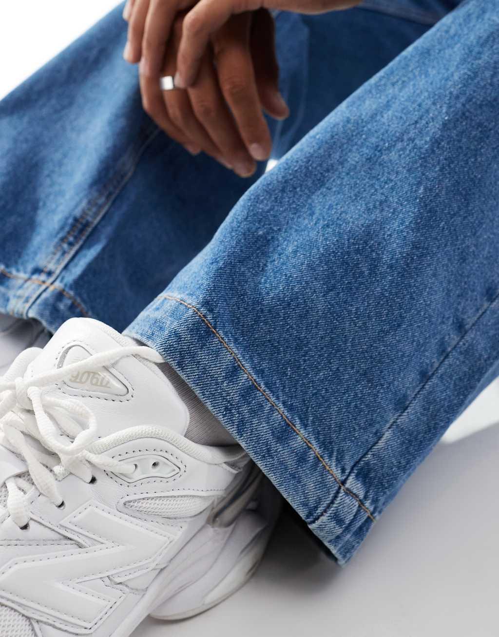 ADPT super baggy jeans in mid wash blue Product Image