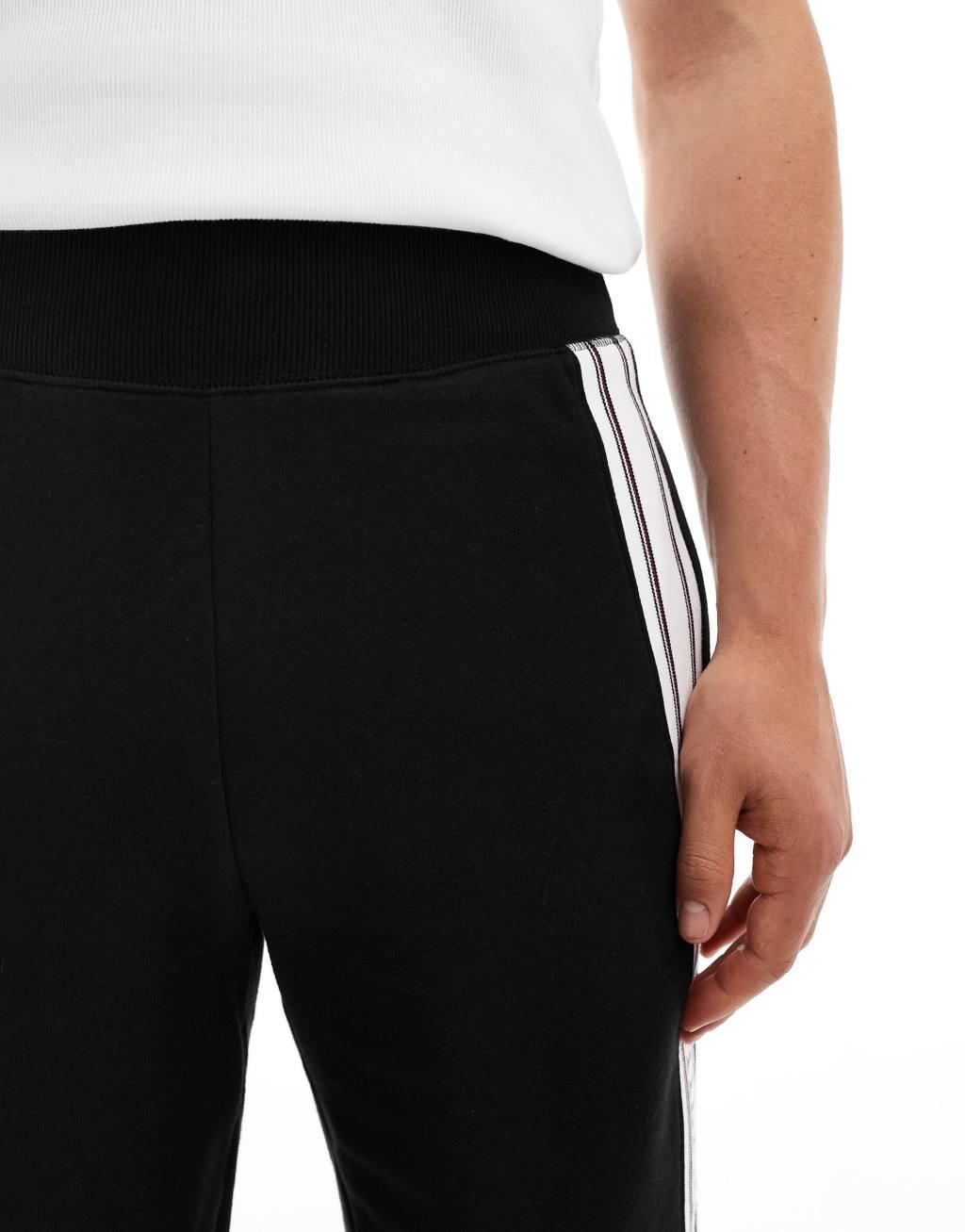 Tommy Hilfiger monotype stripe lounge shorts in black Product Image