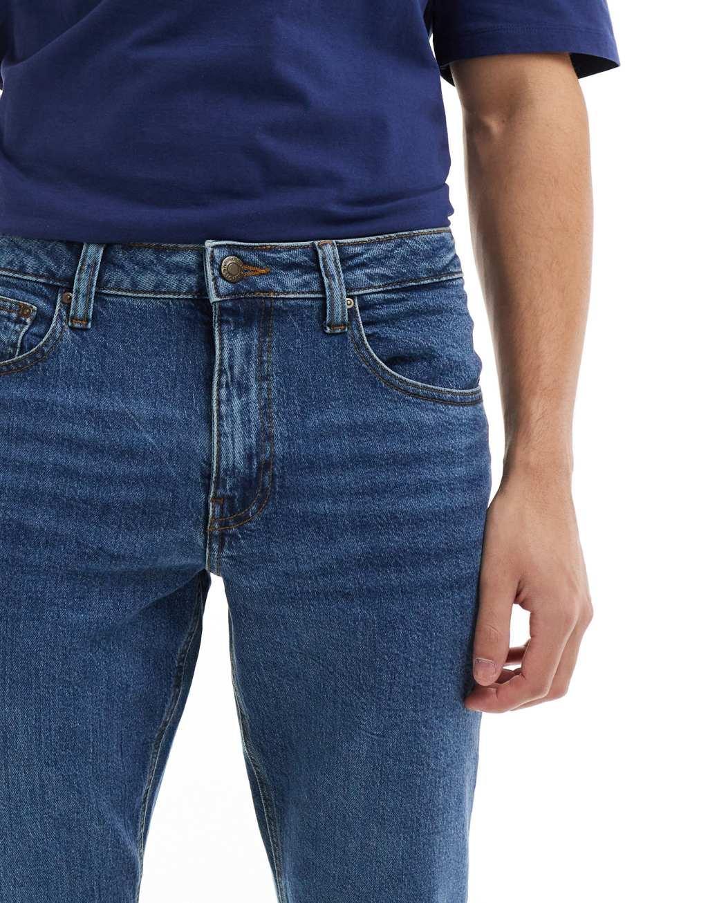 ASOS DESIGN stretch tapered jeans in dark wash blue Product Image