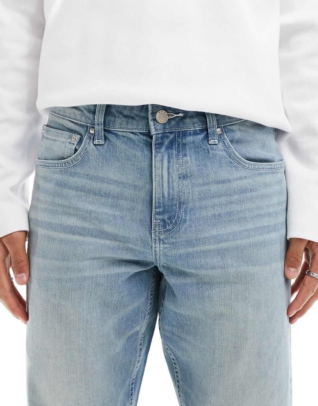 ASOS DESIGN slim jeans with tint in light wash blue Product Image