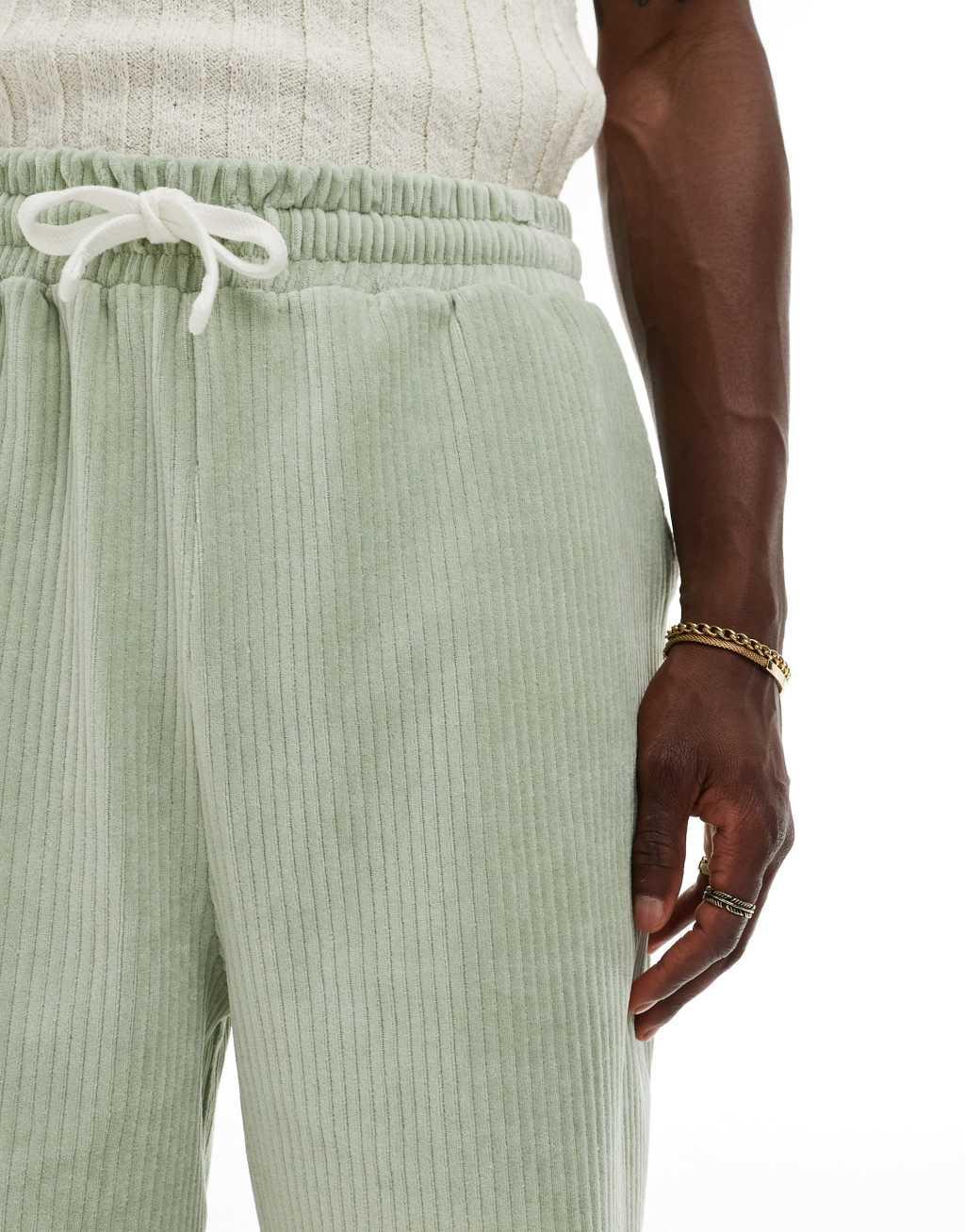 ASOS DESIGN oversized ribbed velour shorts in light green Product Image