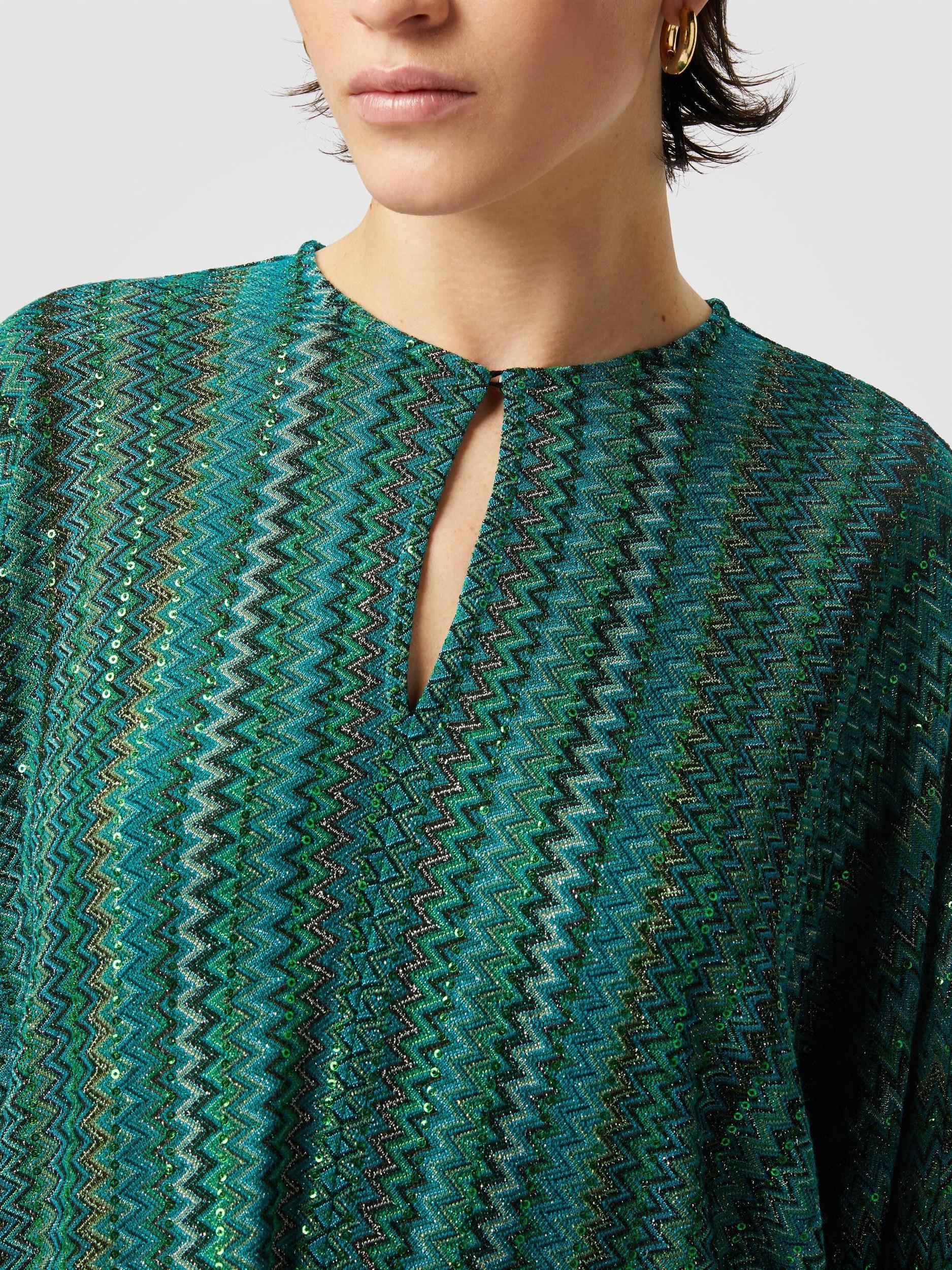 Zigzag long-sleeved blouse with sequins and fringes Product Image