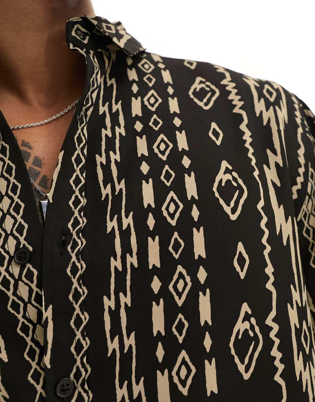 ASOS DESIGN relaxed shirt in pattern print in black Product Image