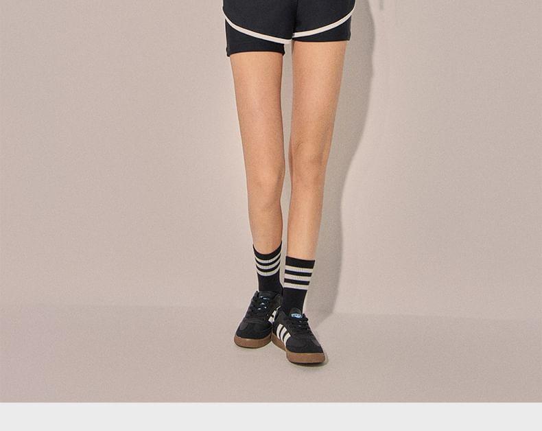 Set: Long-Sleeve Lettering Striped Rash Guard + Contrast Trim Swim Shorts Product Image