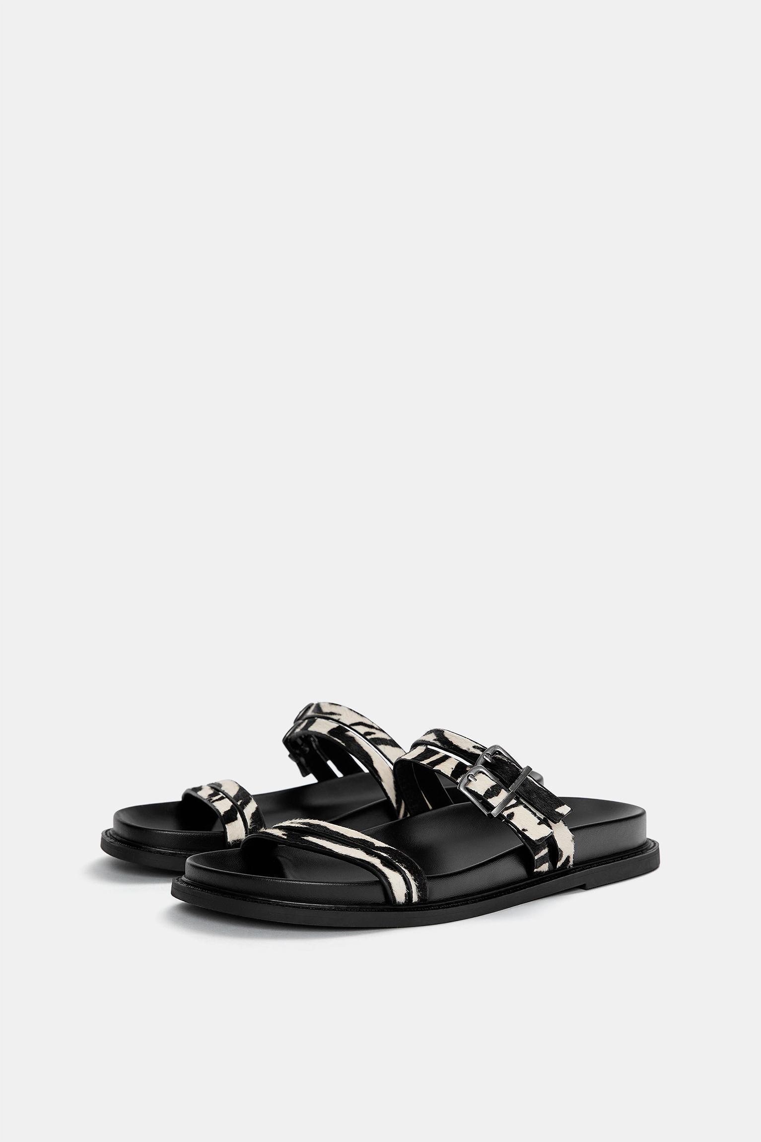 Flat leather animal print sandals Product Image