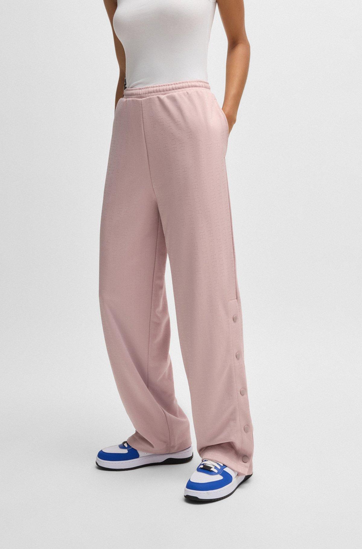 HUGO - Oversize-fit tracksuit bottoms with logo jacquard - Patterned Product Image