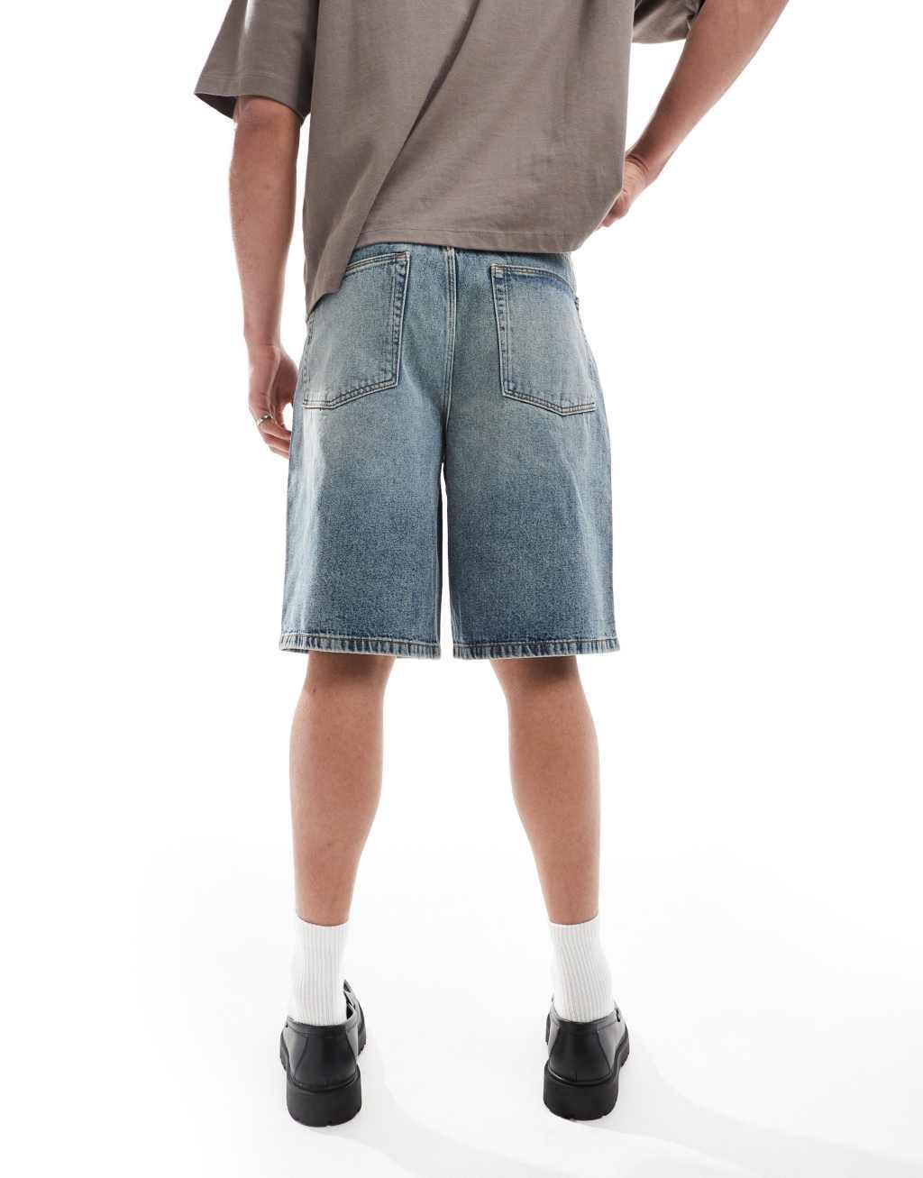 ASOS DESIGN longer length denim jorts in light wash blue with tint Product Image