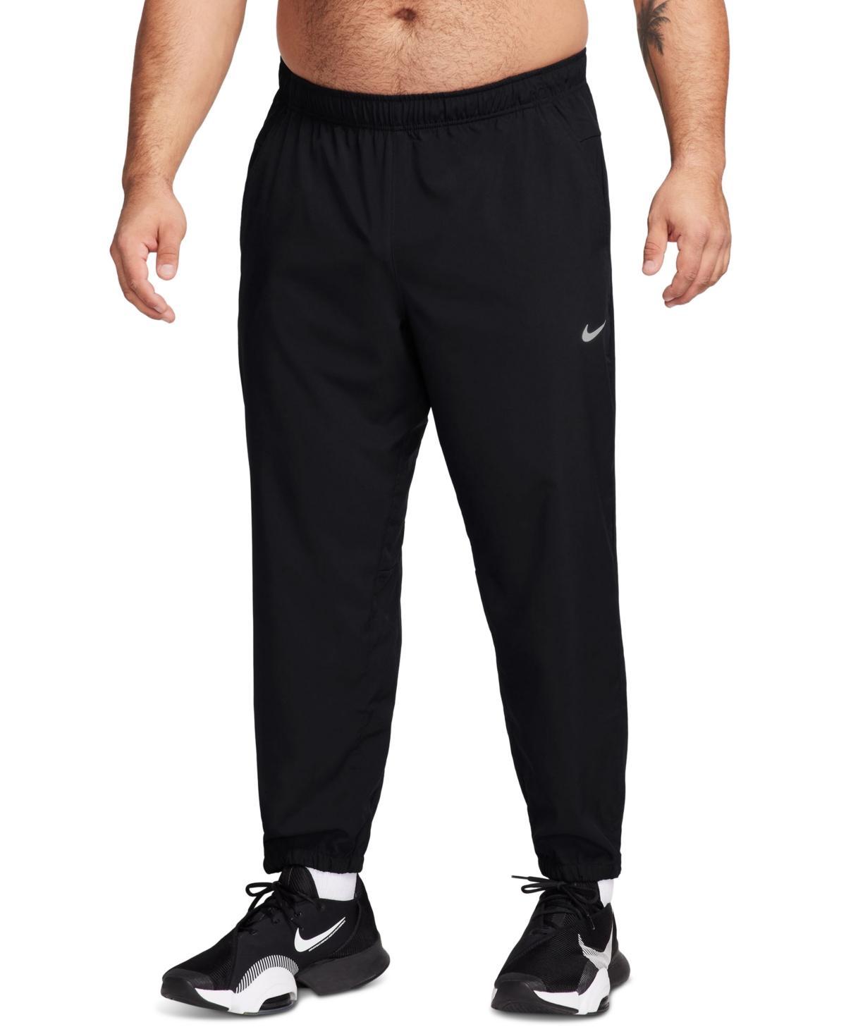 Nike Men's Form Dri-FIT Tapered Versatile Pants in Grey/Smoke Grey Size Large 100% Polyester Product Image