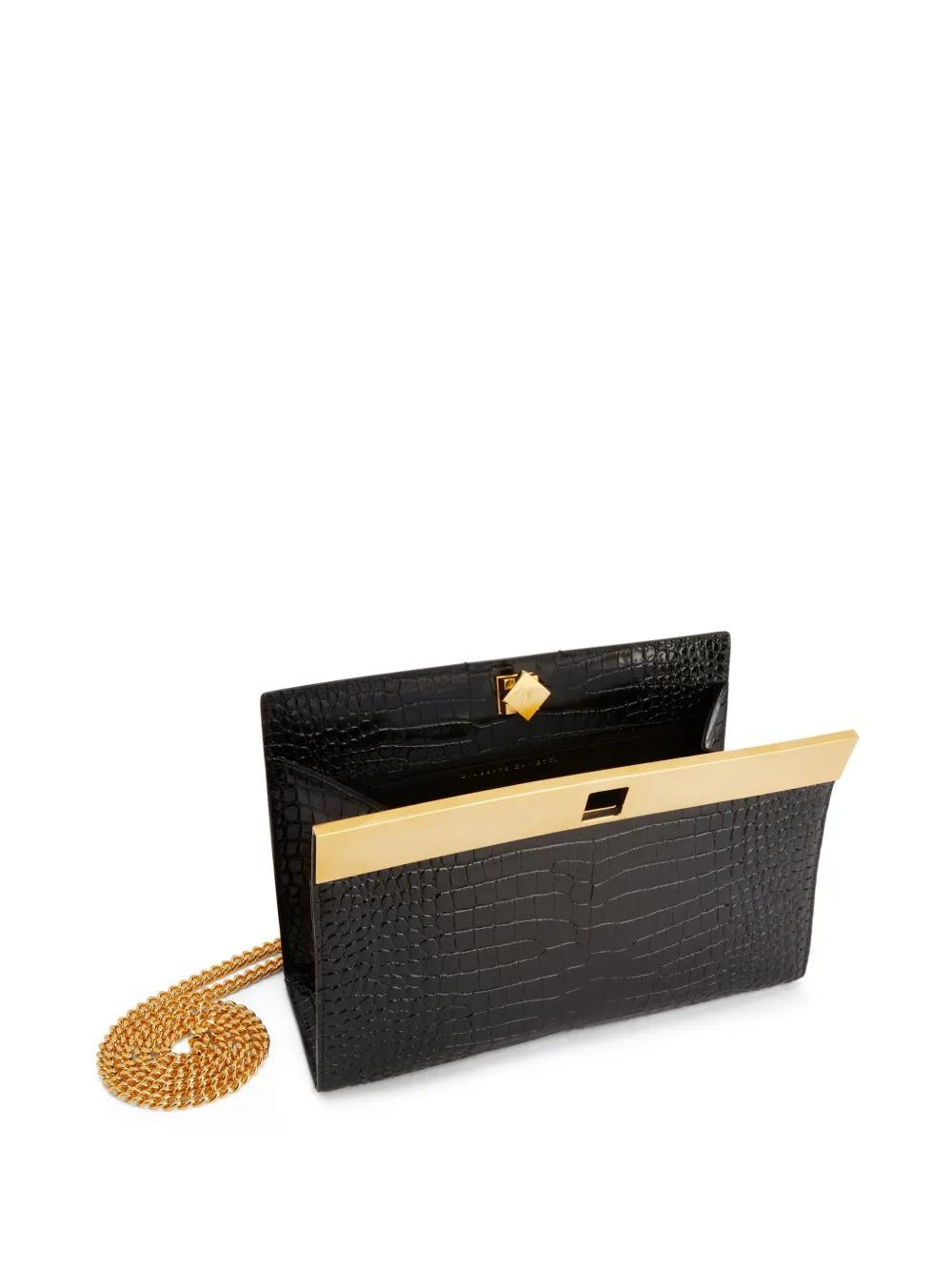 Tanaya crocodile-effect clutch bag Product Image