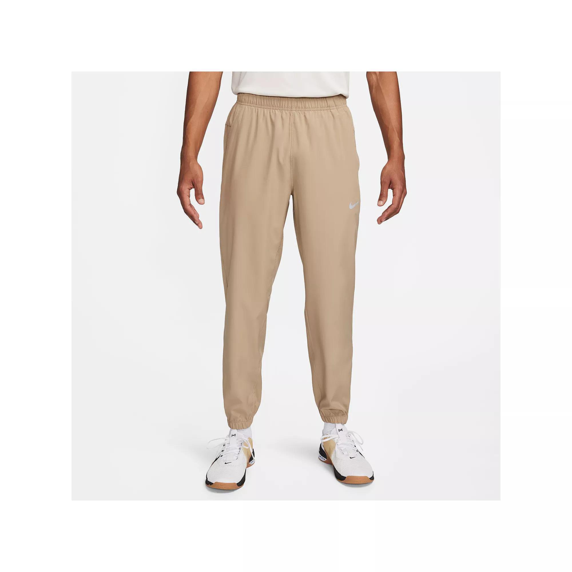 Nike Men's Form Dri-FIT Tapered Versatile Pants in Grey/Smoke Grey Size Large 100% Polyester Product Image