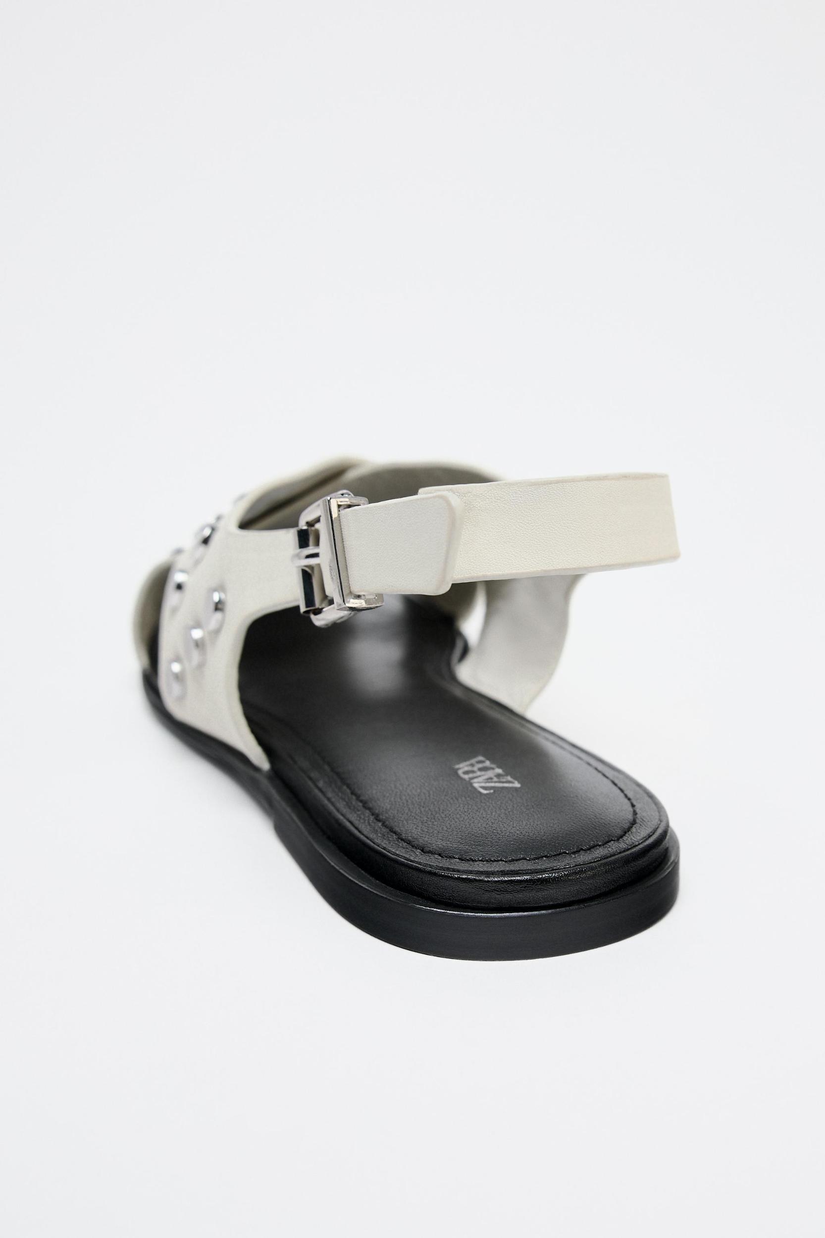 FLAT STUDDED LEATHER CAGE SANDALS Product Image
