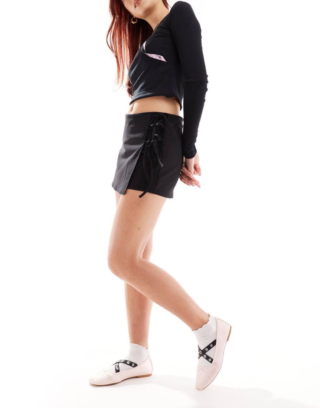 COLLUSION low rise wrap skort with tie detail in black Product Image