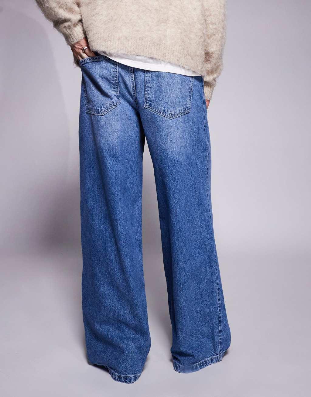ASOS DESIGN super baggy jeans with back print in mid wash blue Product Image