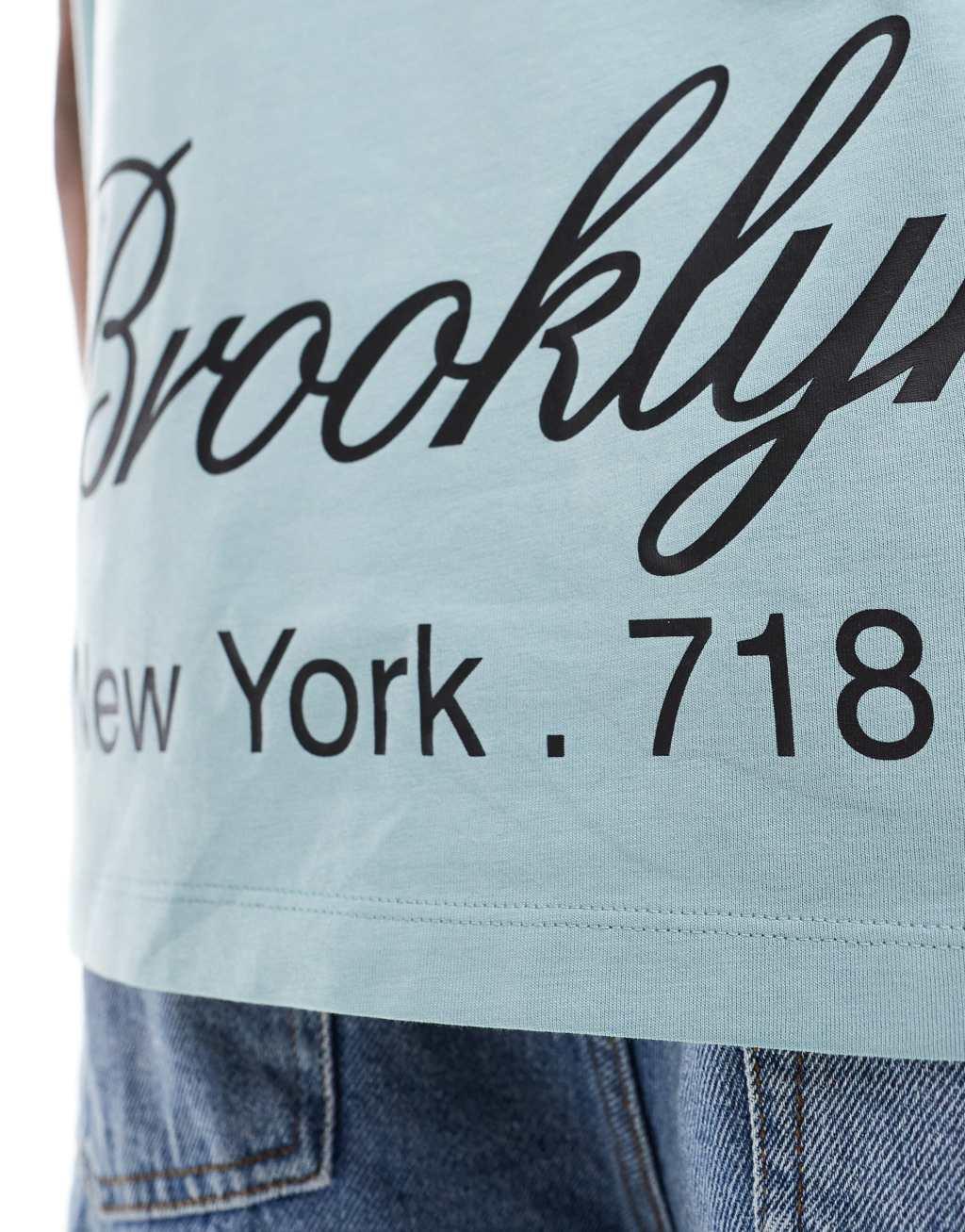 ASOS DESIGN oversized tank top in blue with Brooklyn back print Product Image