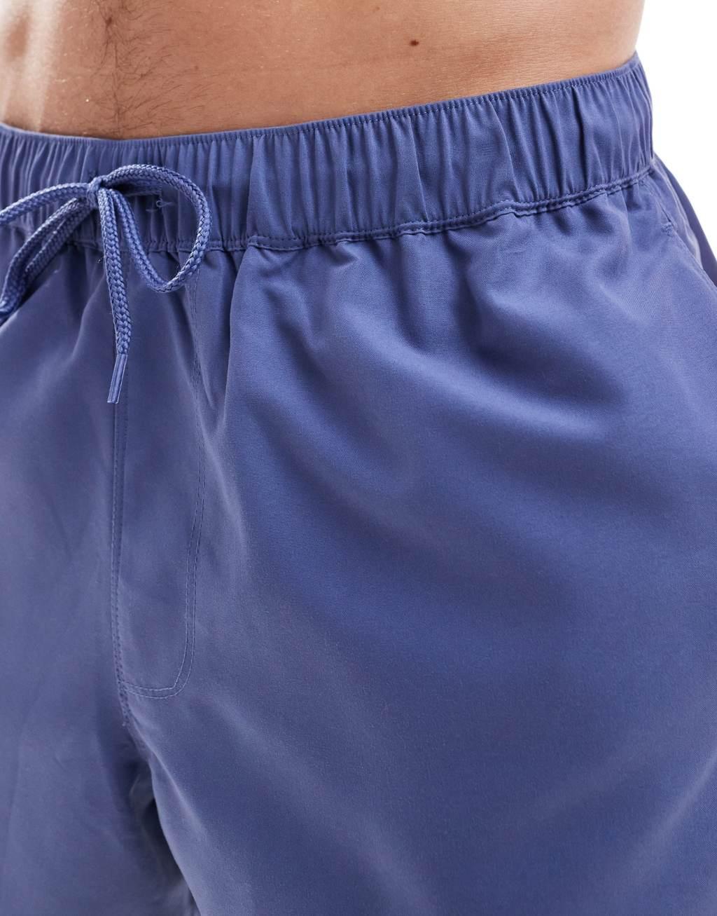 ASOS DESIGN swim shorts in mid length in blue Product Image
