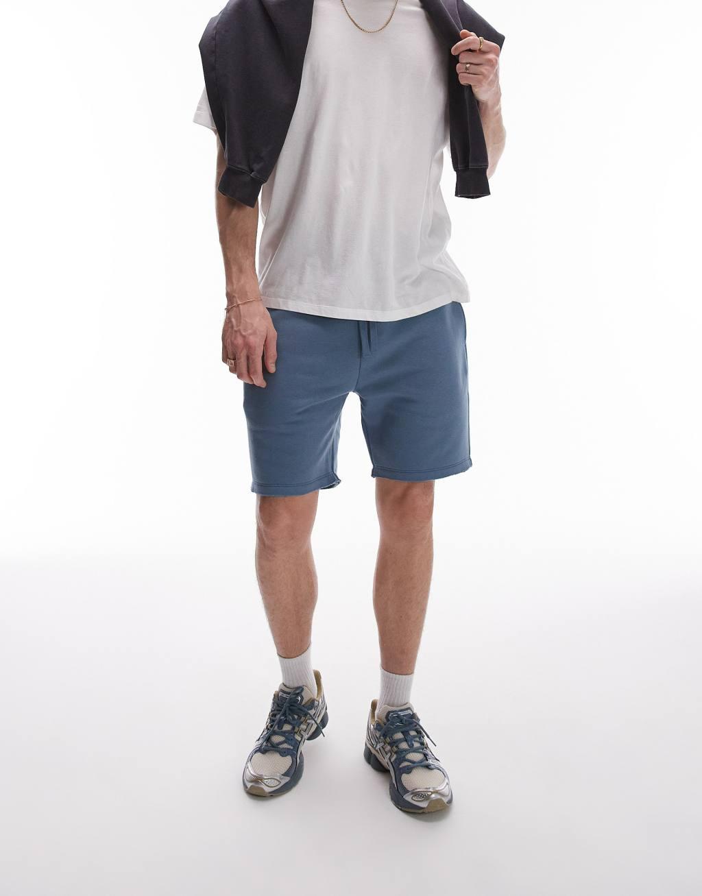 Topman classic fit jersey shorts with raw hem in blue Product Image