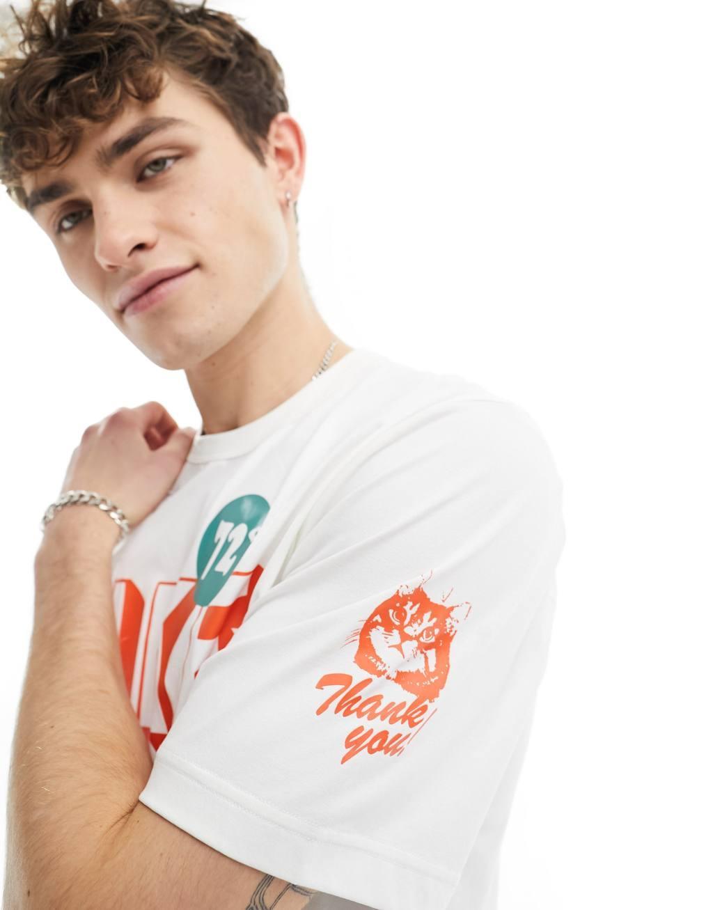 Nike Training Dri-FIT bodega graphic t-shirt in white and orange Product Image