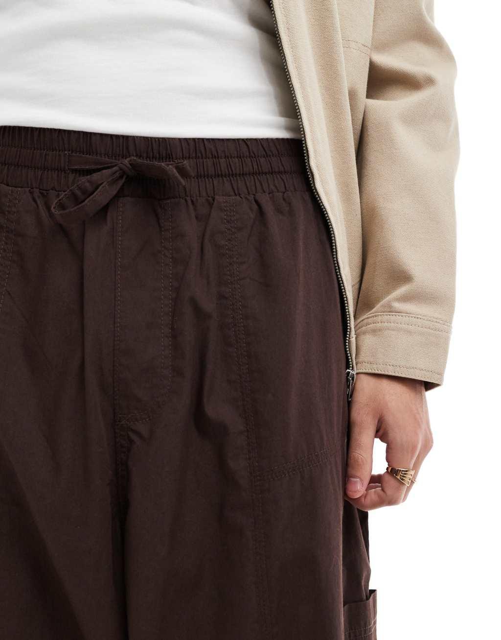 ASOS DESIGN super baggy cargo pants with panel detailing in brown Product Image