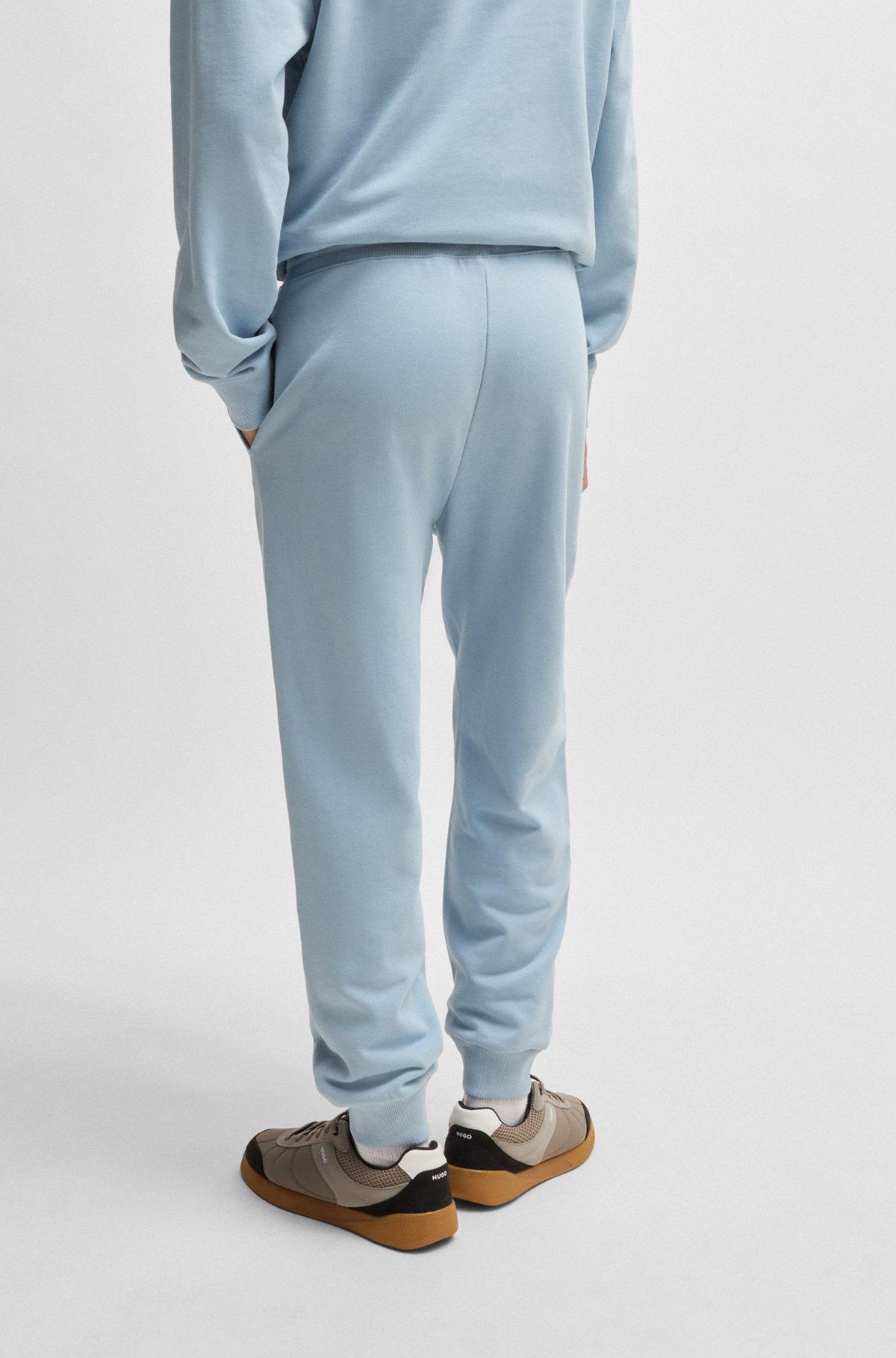Cotton-terry tracksuit bottoms with logo print Product Image