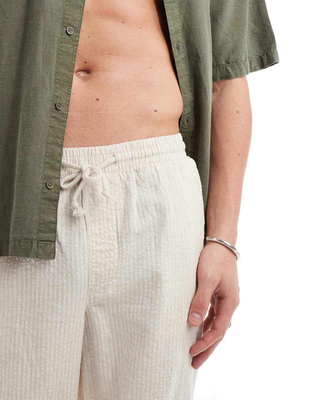 ASOS DESIGN wide linen mix seersucker pants in white stripe Product Image