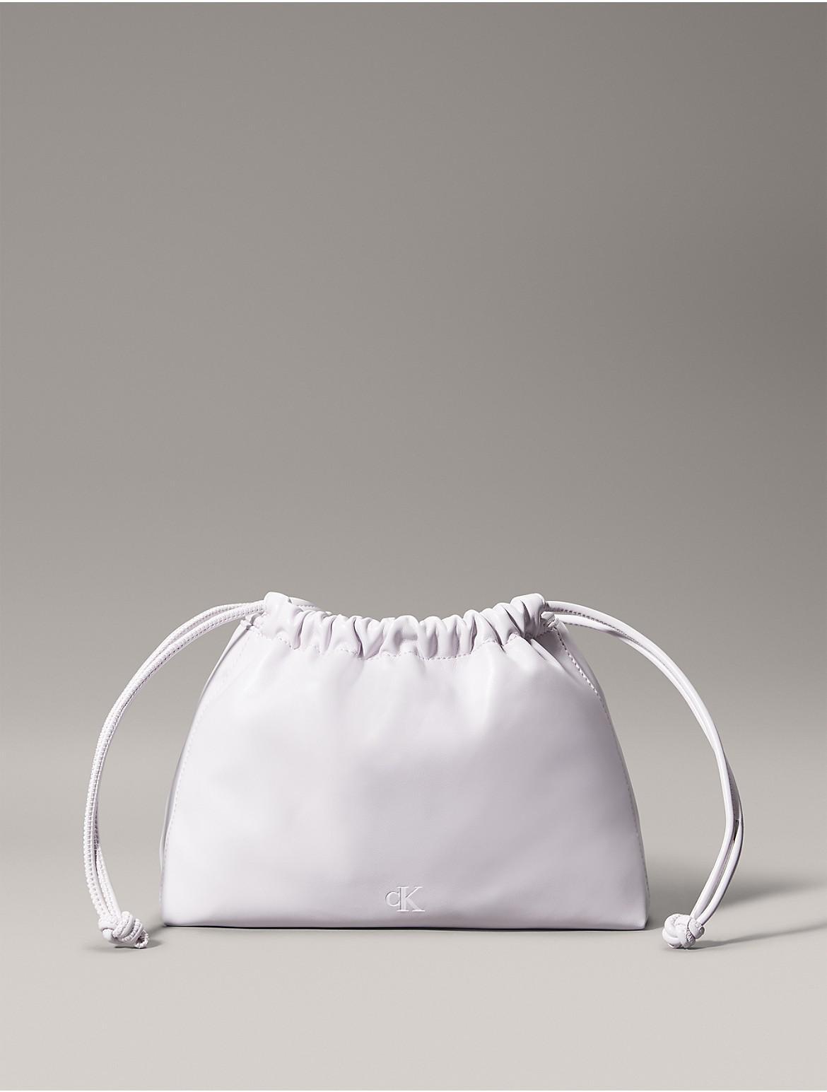 Calvin Klein Women's Monogram Logo Drawstring Crossbody Bag - White Product Image
