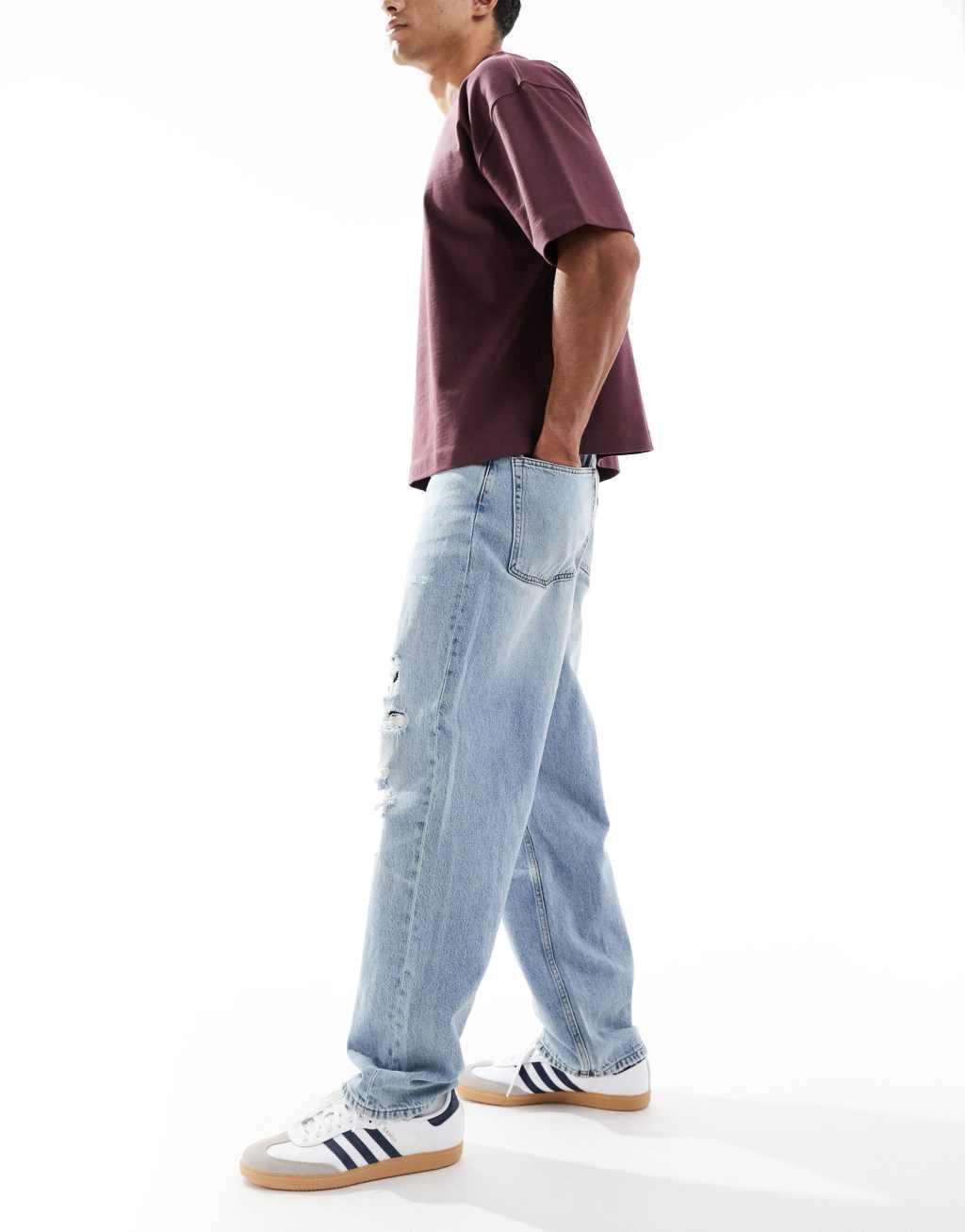 ASOS DESIGN baggy jeans with rips in light wash  Product Image