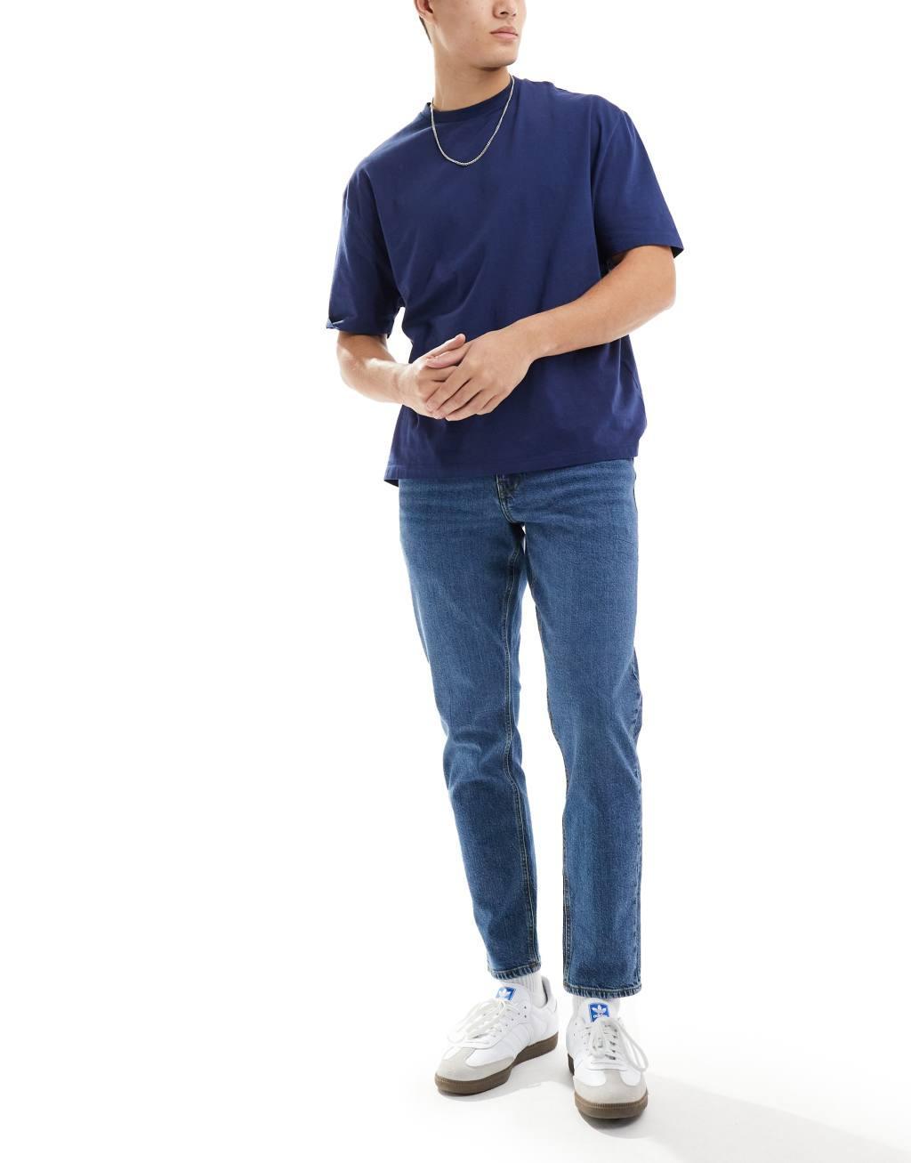 ASOS DESIGN stretch tapered jeans in dark wash blue Product Image