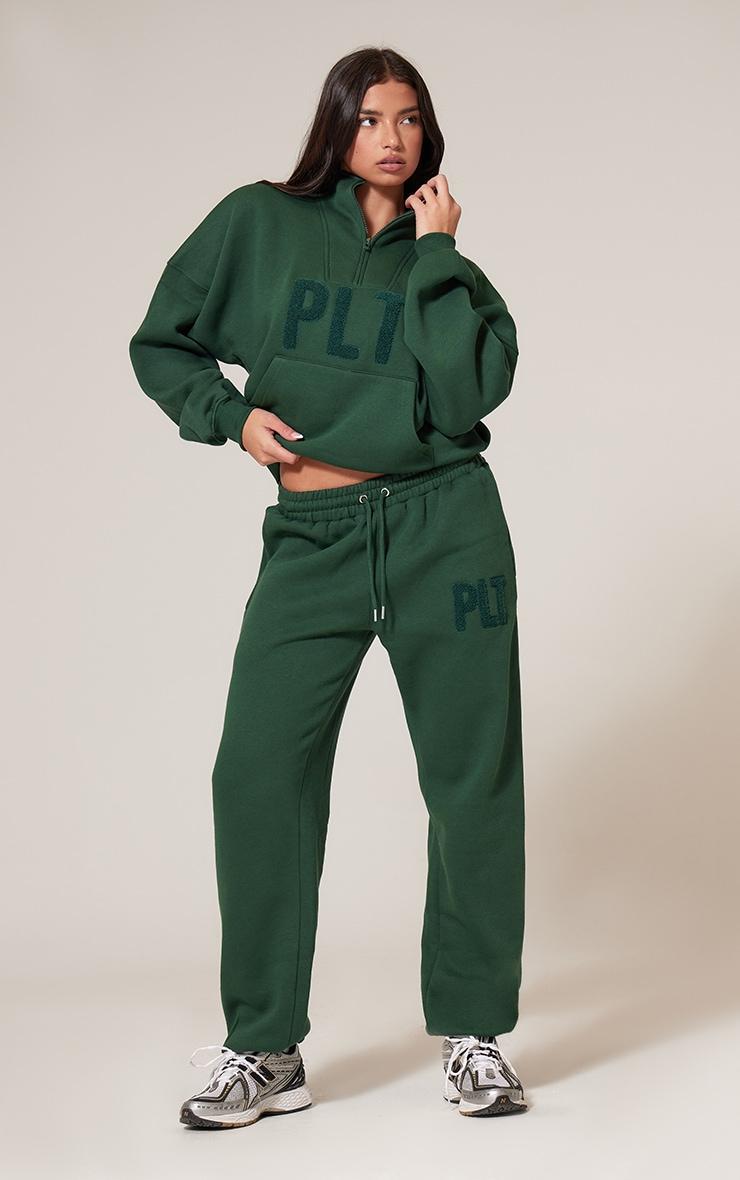 PRETTYLITTLETHING Forest Green Borg Applique Quarter Zip Sweatshirt Product Image