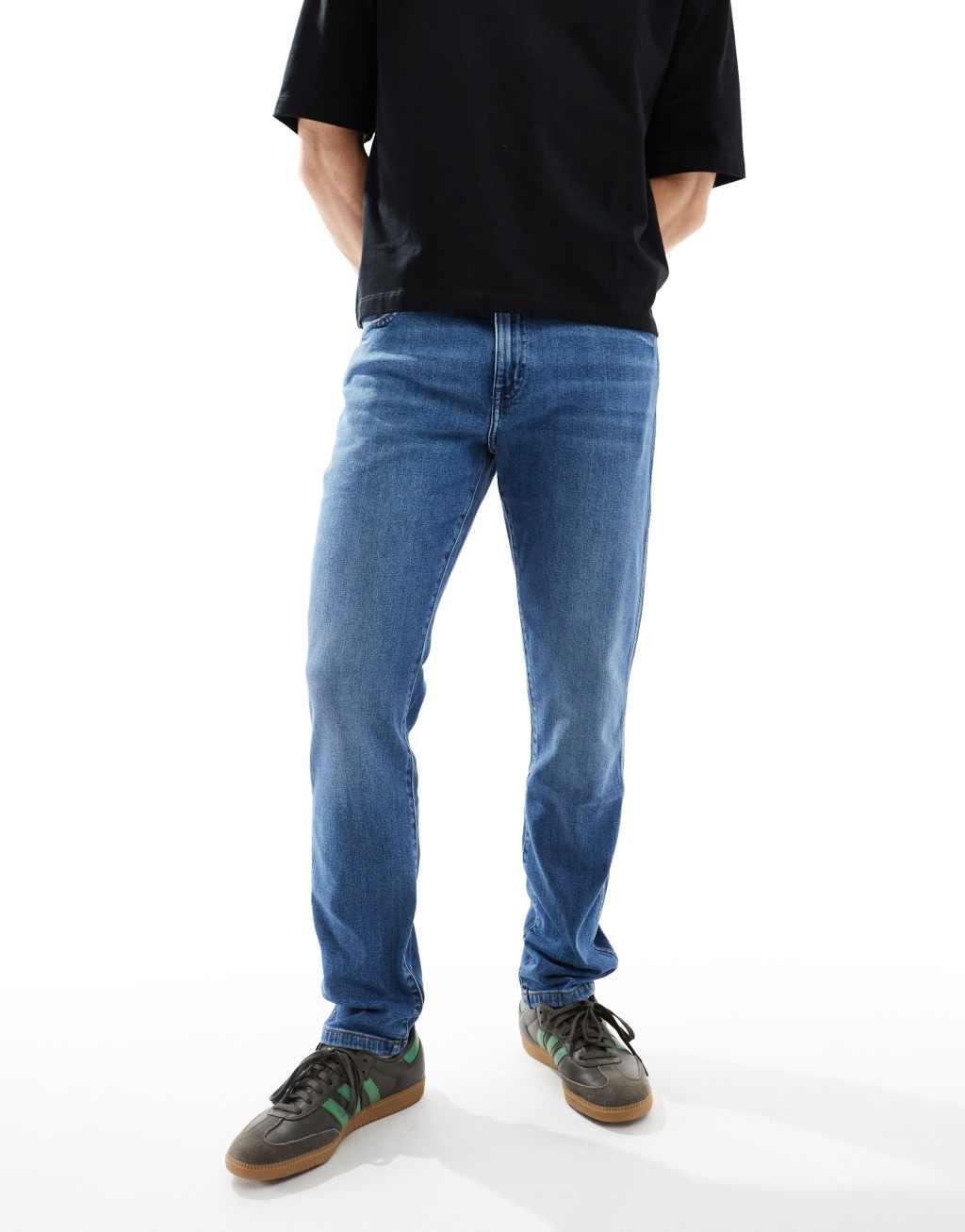 Wrangler Larston slim tapered fit jeans in light wash Product Image