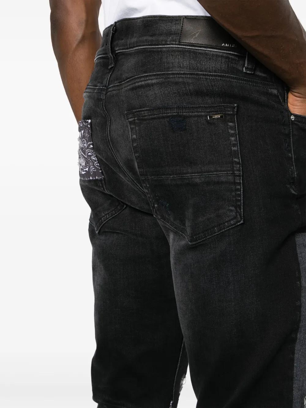 Artisanal distressed slim-fit jeans Product Image
