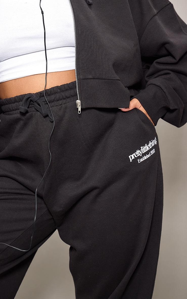 PRETTYLITTLETHING Plus Black Printed Premium Wide Leg Sweatpants Product Image